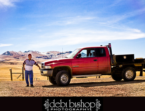 My dad and his truck with Bear Paw Mountains in the background